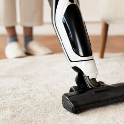 vacuum-cleaning-rug-floor