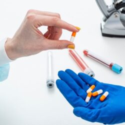 man-hazmat-suit-with-medicine-pills_23-2148483256