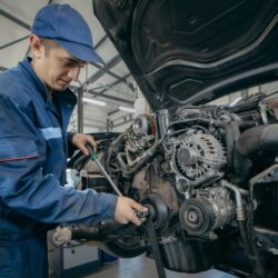auto-mechanic-repairs-engine-replacing-timing-chain_281858-5349