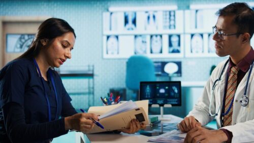 general-practitioner-consulting-patient-reviewing-x-ray-test-results (1) general-practitioner-consulting-patient-reviewing-x-ray-test-results (1)