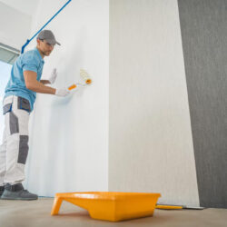 men-applying-vinyl-wallpaper-room_1426-7468