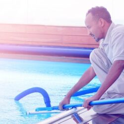 bigstock-pool-cleaner-during-his-work-249174202-700x466