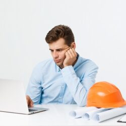 people-job-tiresome-overwork-concept-bored-sleepy-male-engineer-working-late